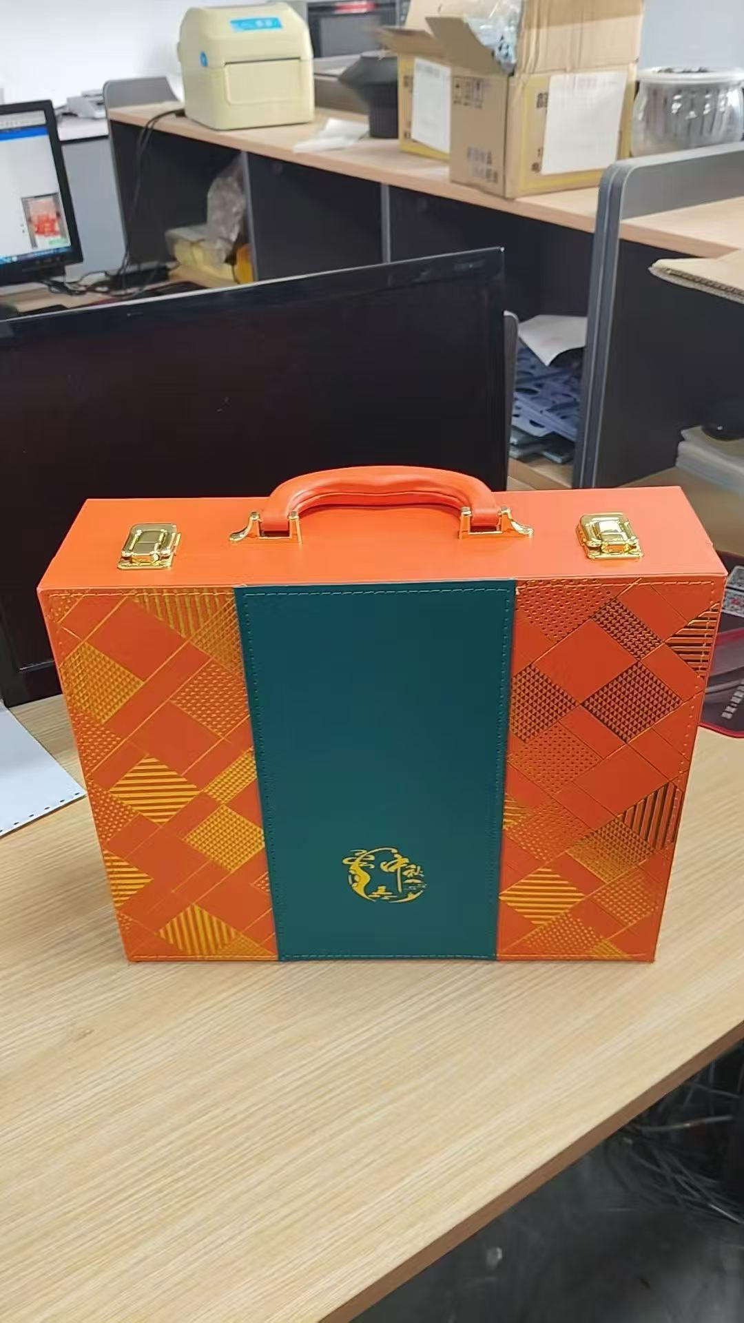 Orange and green leather wine case with wood frame