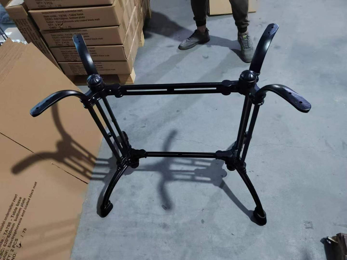 Close-up of black folding table frame showing four legs and folding mechanism detail