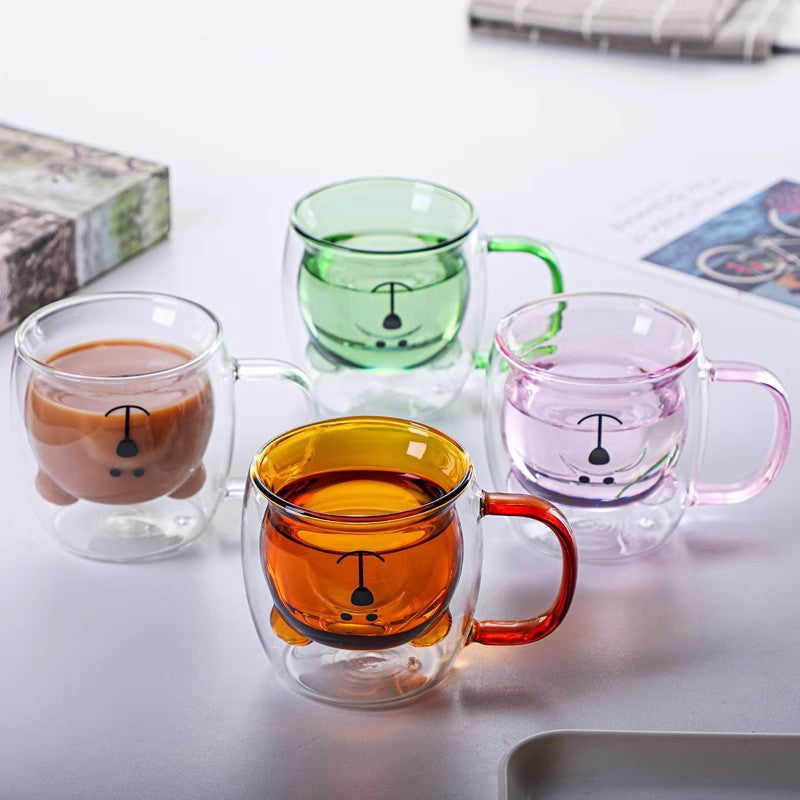 Clear double-wall glass mug with colored interior and bear face print