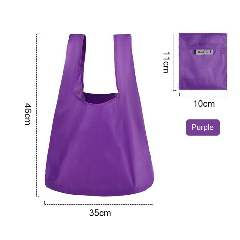 BAGCU foldable shopping bag in yellow folded flat on a plain background