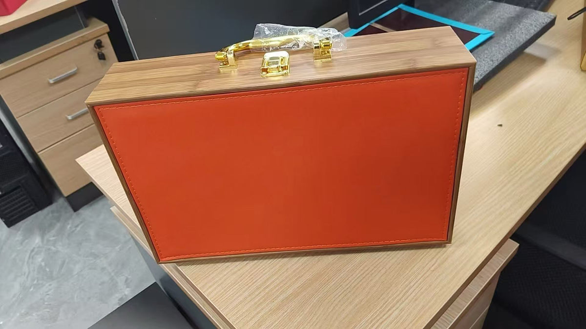 Orange leather wine case with metal clasp and carry handle