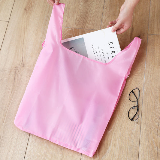 BAGCU nylon foldable shopping bag in blue folded into a small square