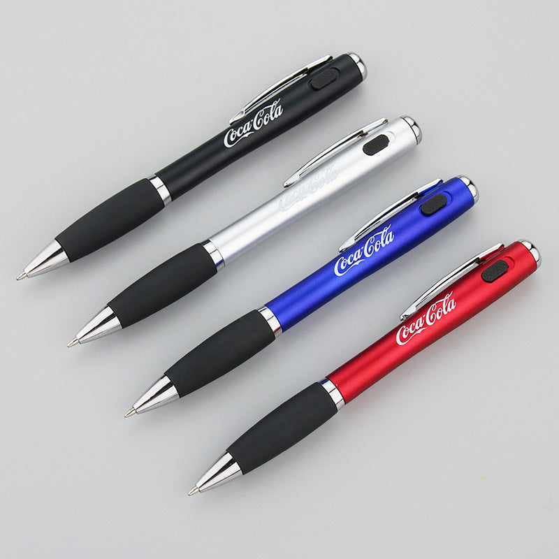 Coca-Cola LED flashlight pen with black rubber grip and red barrel