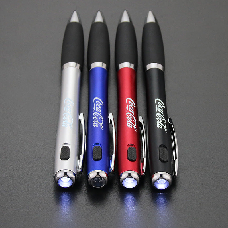 Illuminated tip of the Coca-Cola LED pen glowing when pressed