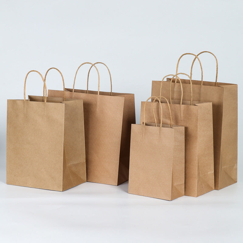 Single colored paper tote bag with paper rope handles on a plain background