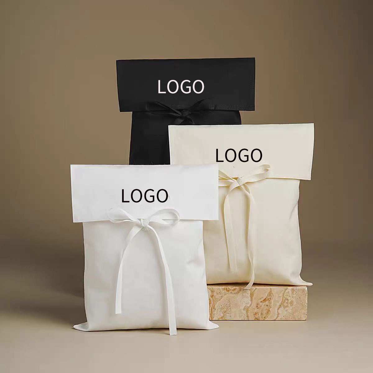 Canvas flap pouch with ribbon tie opened to show interior space for small items