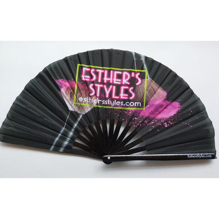 Open cloth folding fan showing printed design on the fabric leaf