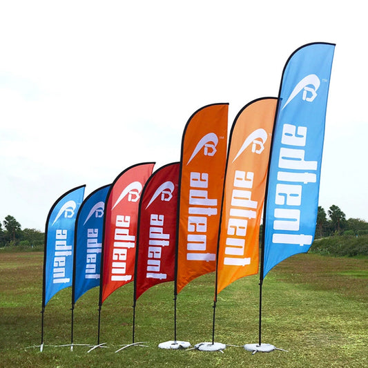 Blade flag kit laid out with metal pole sections, cross base and water bag base
