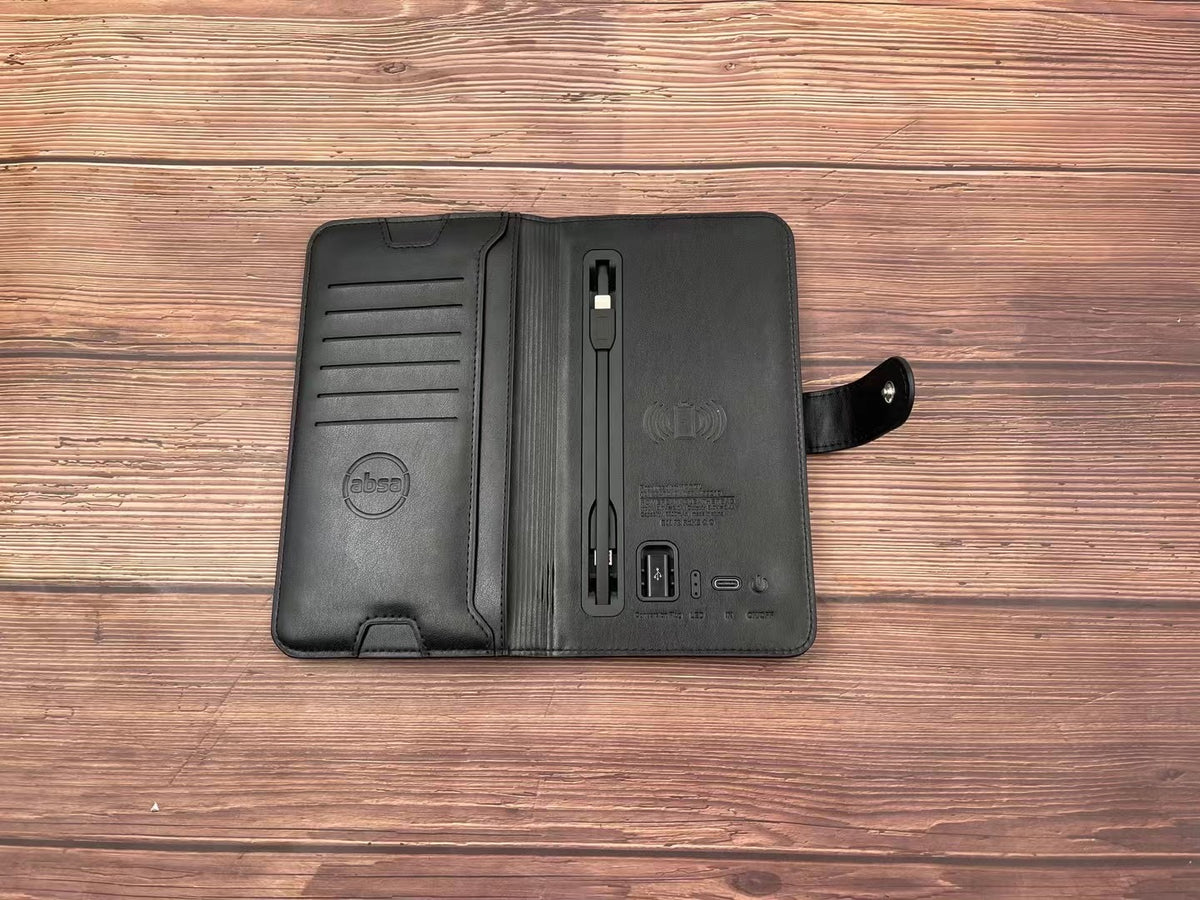 Close-up of the notebook cover showing the integrated phone stand and charging port