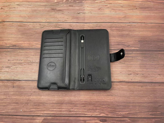 Close-up of the notebook cover showing the integrated phone stand and charging port