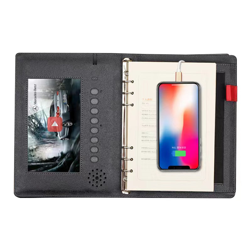 Angled view of the power bank notebook with a phone resting on the stand