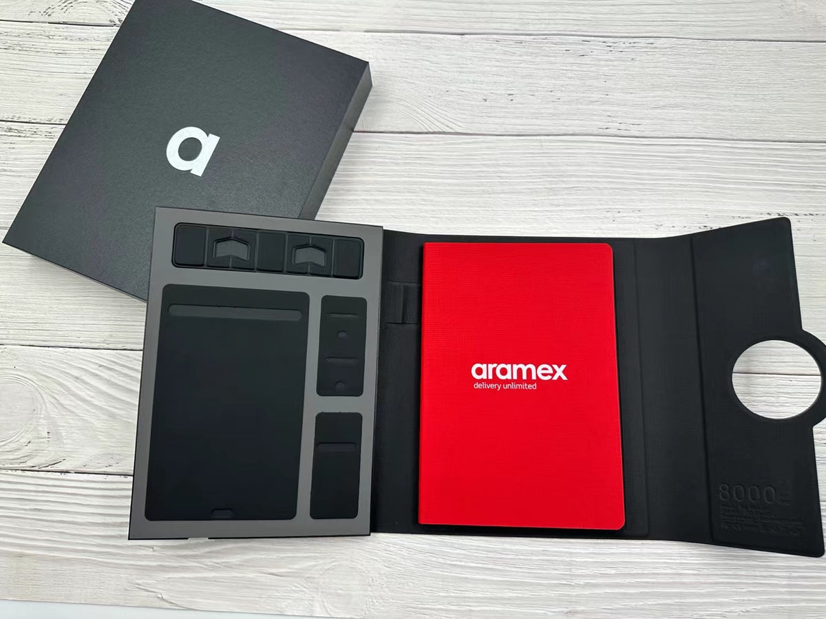 Flat lay of the custom notebook with storage pages, cards and a pen