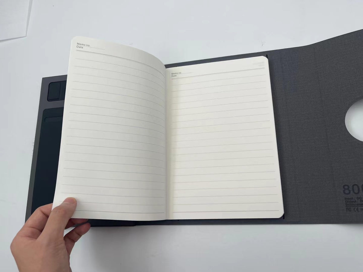 Notebook with phone stand in use, holding a smartphone in landscape mode