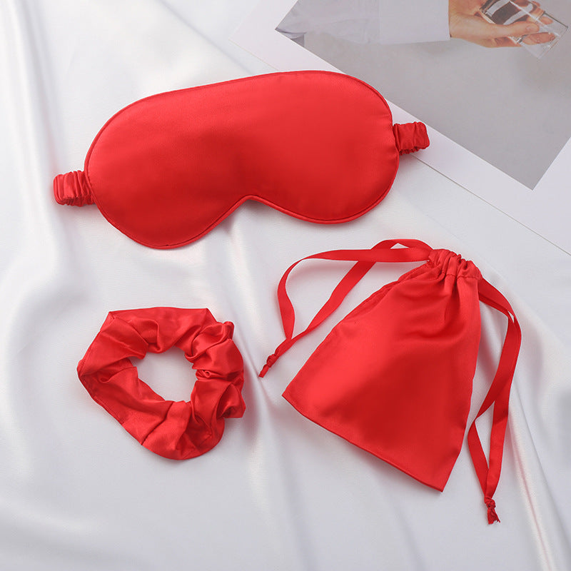 Satin eye mask, scrunchie and drawstring pouch set in matching blush pink
