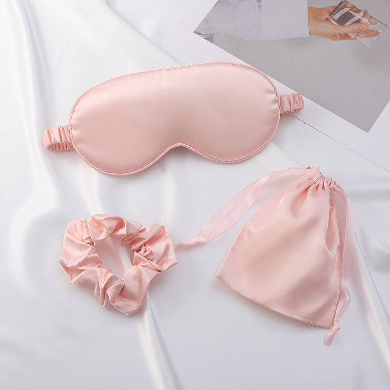 Close-up of smooth satin sleep mask with soft sheen and elastic strap