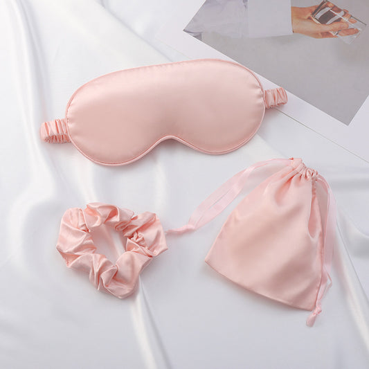 Close-up of smooth satin sleep mask with soft sheen and elastic strap