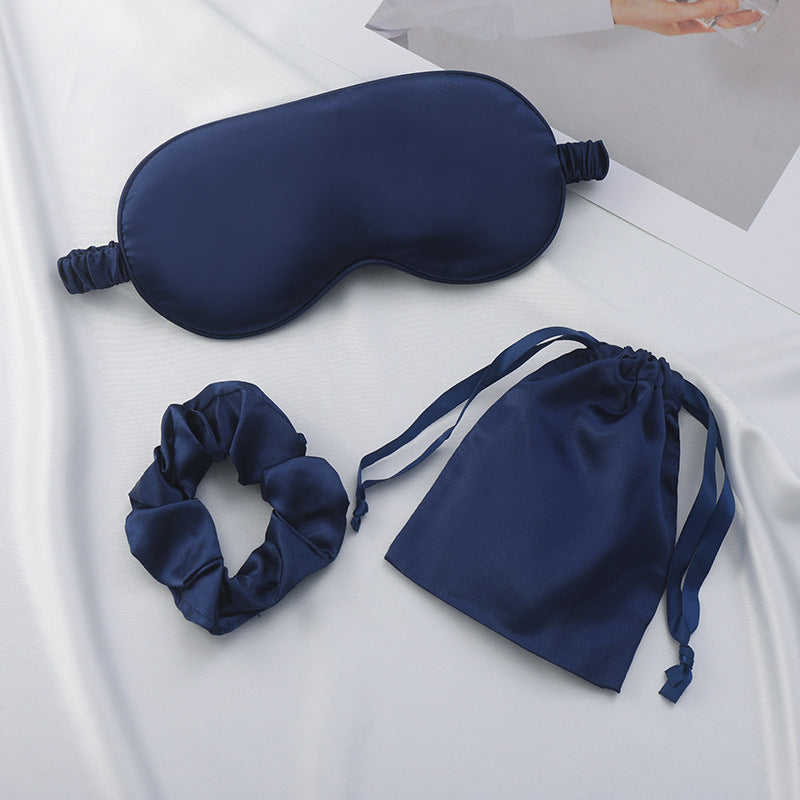Satin eye mask and scrunchie set in sage green on a clean background