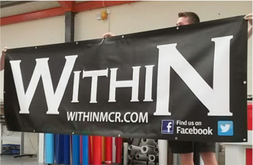 Close-up of reinforced corner grommet and tie on a custom vinyl banner