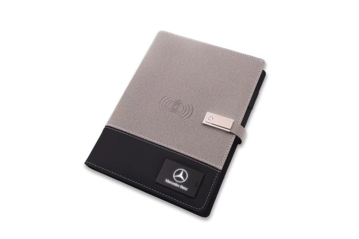 Wireless charging notebook placed on cafe table with coffee cup nearby