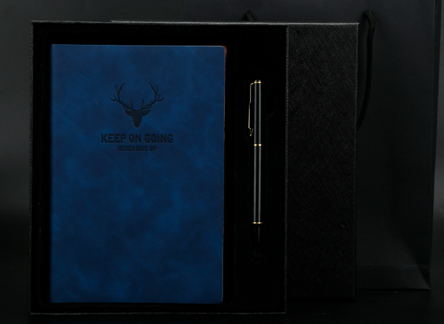 Burgundy leather deer-head notebook displayed with a matching pen