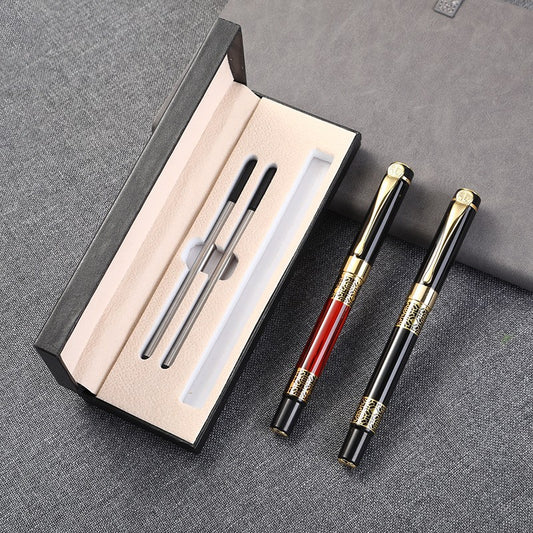 Silver pen placed in beige slot of black leather flip-top gift box