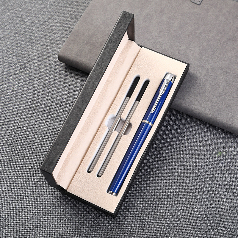 Black leather pen gift box with two beige pen slots and silver pen set