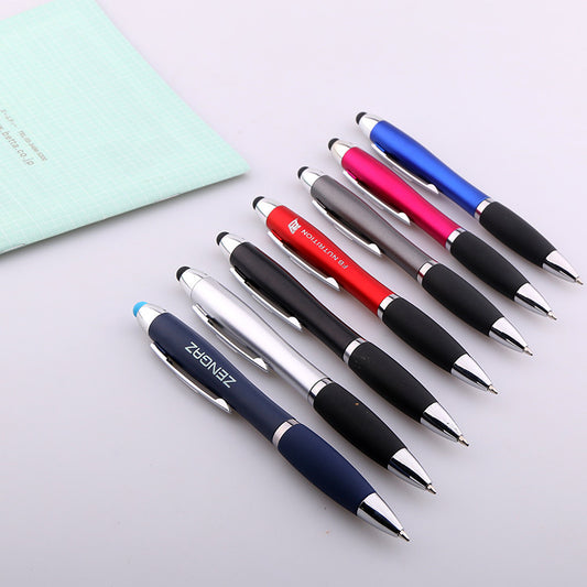 Close-up of black rubber grip and stylus tip on metal ballpoint pen