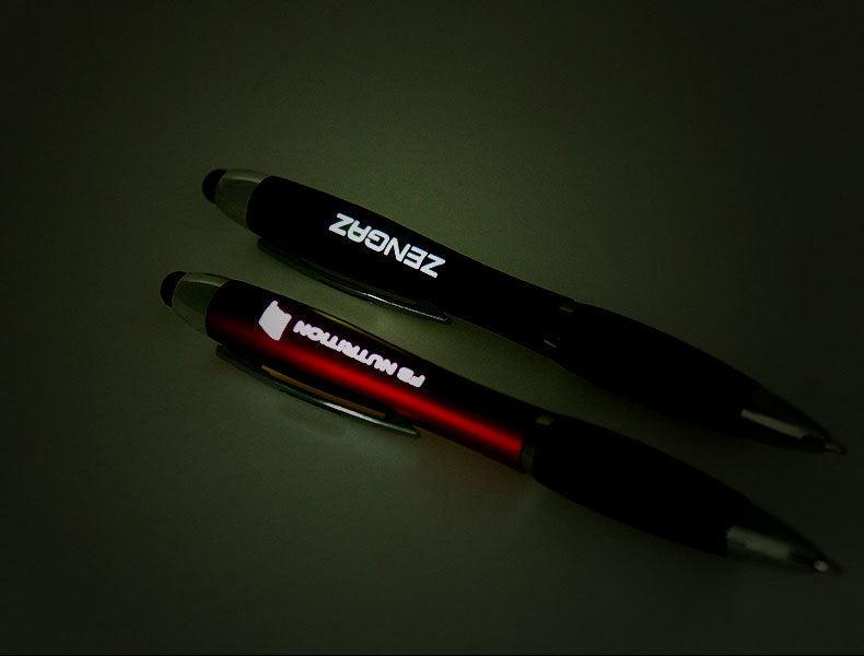 Metal touchscreen ballpoint pen standing upright showing full barrel and clip