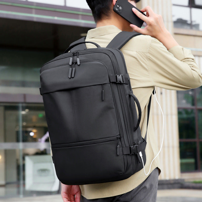 Business laptop backpack showing padded laptop compartment and compression straps