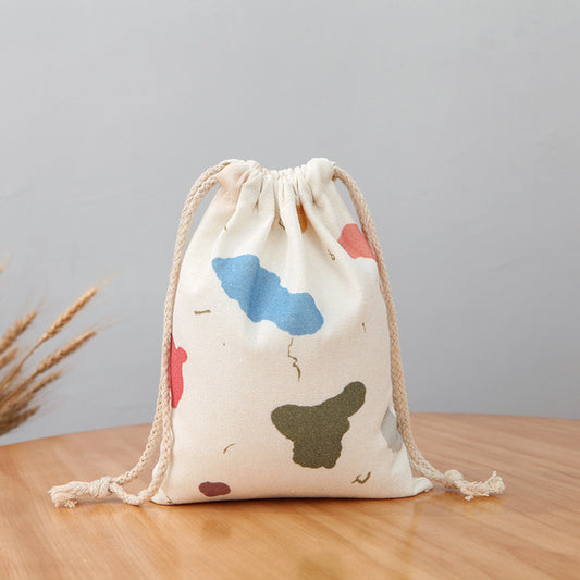 Set of printed cotton linen drawstring pouches in different sizes for cafe packaging