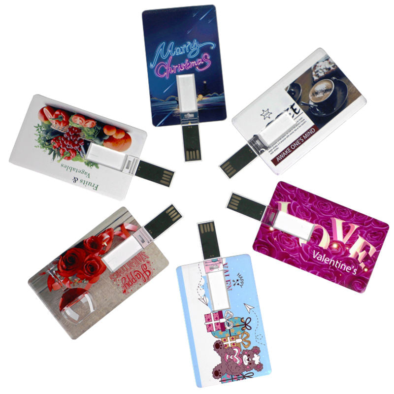 Card shaped USB flash drives fanned out showing different custom printed logo designs