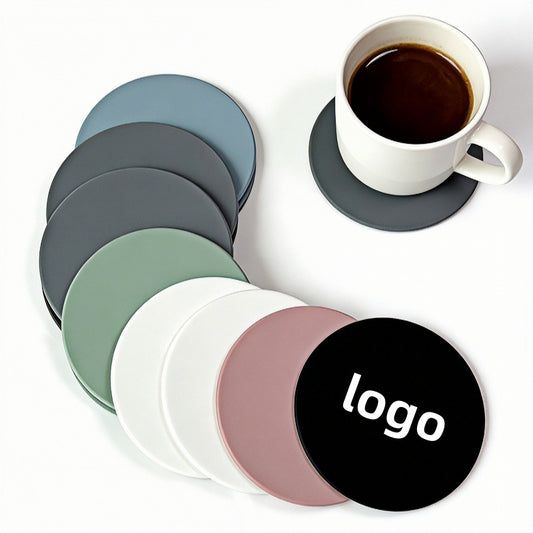 Close-up of round rubber drink coaster showing soft matte texture and stitched edge detail