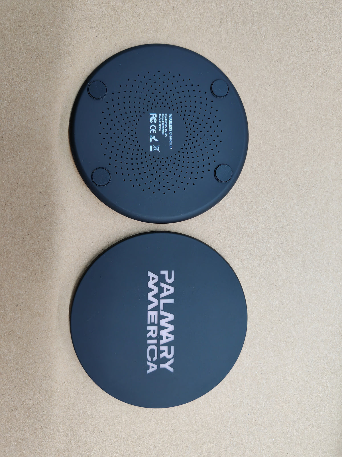 Ultra-slim round wireless charger standing upright showing its thin profile