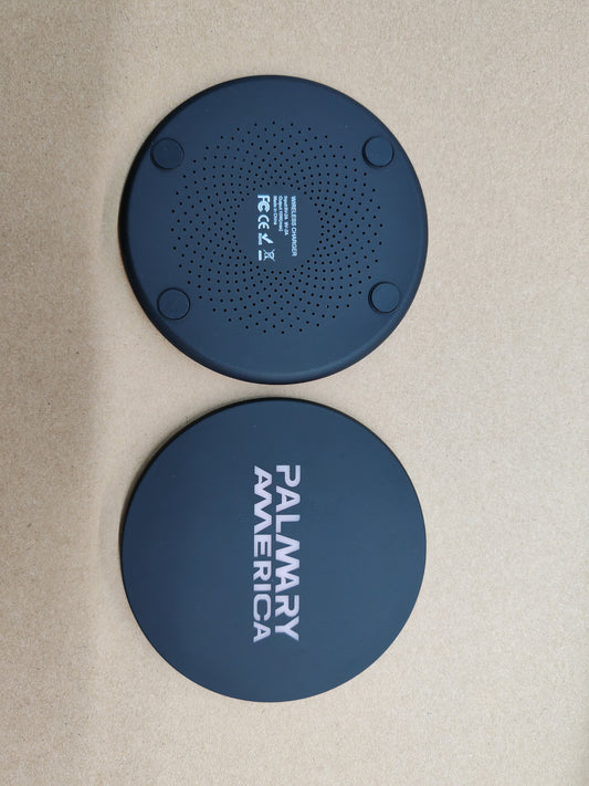 Ultra-slim round wireless charger standing upright showing its thin profile