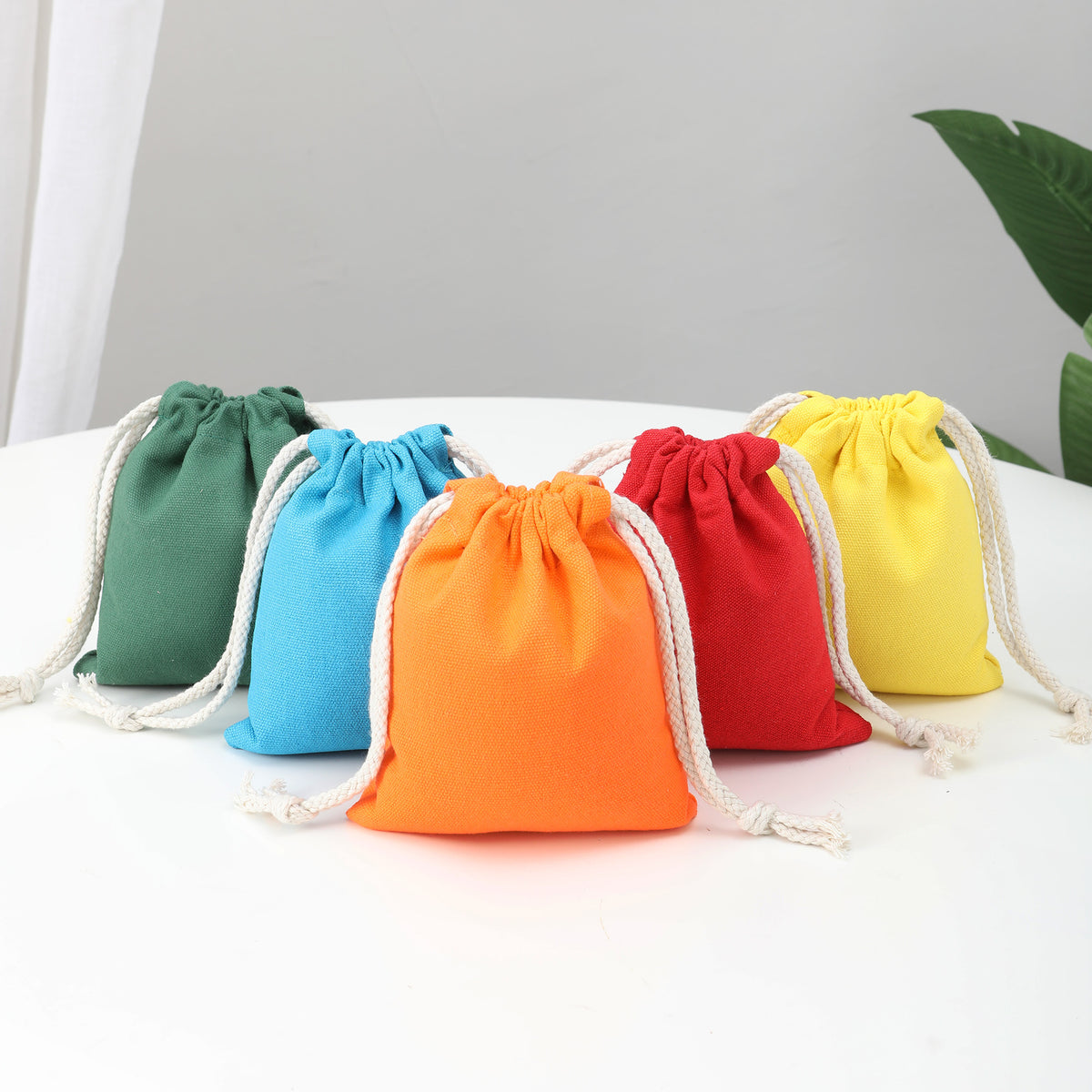 Canvas drawstring pouch in a solid darker color showing the fabric texture and cord detail
