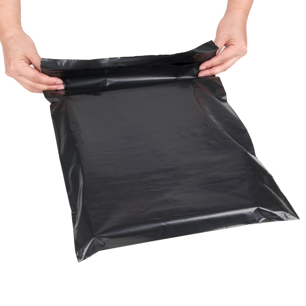 White poly mailer bag with a shipping label applied on the front