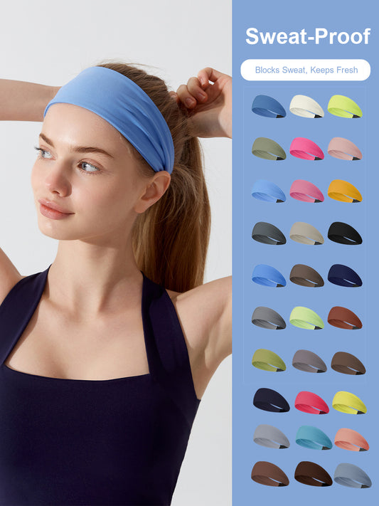 Model wearing the wide black headband during a workout